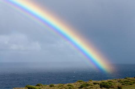vivid rainbow over ocean