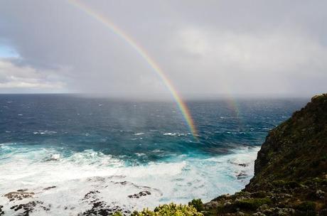 twin rainbows over ocean