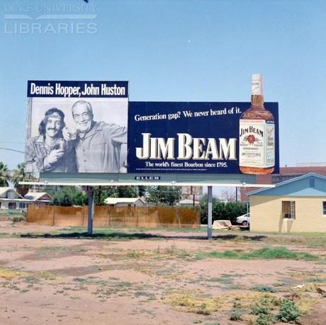 Hopper_Bill board advertisement for Jim Beam whisky featuring Dennis Hopper and John Huston, 1972. Retrieved from Duke University Library.