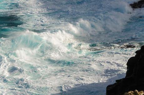 waves breaking against rocks