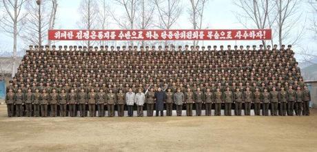 Kim Jong Un poses for commemorative photograph with service members and officers of the command element of KPA Unit #1973