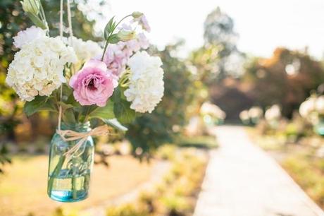 flowers hang from tree at wedding