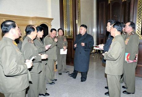 Kim Jong Un (C) talks with senior KPA officials and commanders after watching a rehearsal by the KPA Song and Dance Ensemble in Pyongyang on 24 March 2013 (Photo: Rodong Sinmun)