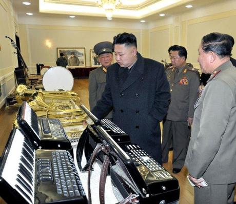 Kim Jong Un examines accordions and brass instruments, produced by KPA factories and units (Photo: Rodong Sinmun)