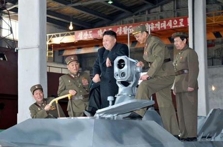 Kim Jong Un stands on a combat vehicle during an inspection of KPA Unit #1501 on 24 March 2013.  Also in attendance is Gen. Kim Yong Chol (2nd L), Chief of the Reconnaissance General Bureau and spokesman of the KPA Supreme Command (Photo: Rodong Sinmun)