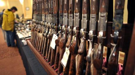 Shotguns sit on display at a gun show in Stamford, Conn. in January.