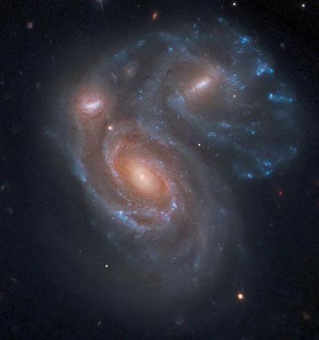 Three galaxies collide photography. Picture taken with Hubble Telescope 