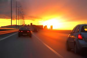 cars at sunset on the highway in traffic