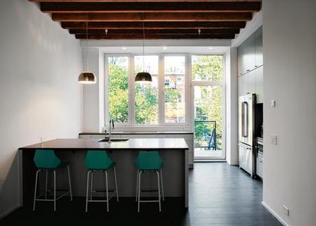 Modern kitchen with reclaimed stained maple flooring