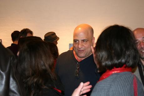 Gallery Owner Peter Surace charming his guests