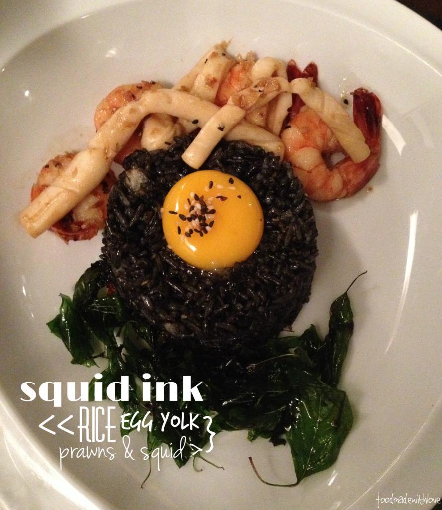 Squid ink rice with prawns and squid
