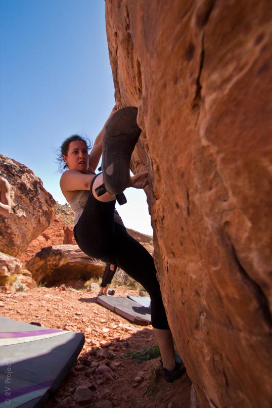 Alana toes in on the backside of the Monkey Bars Boulder.