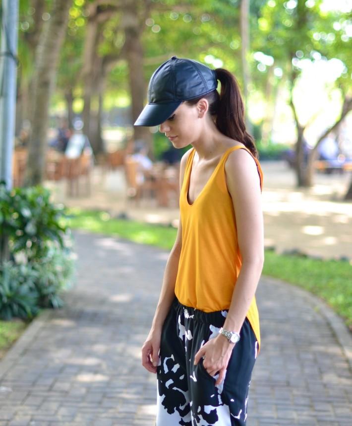 outfit orange strappy zara top leather cap