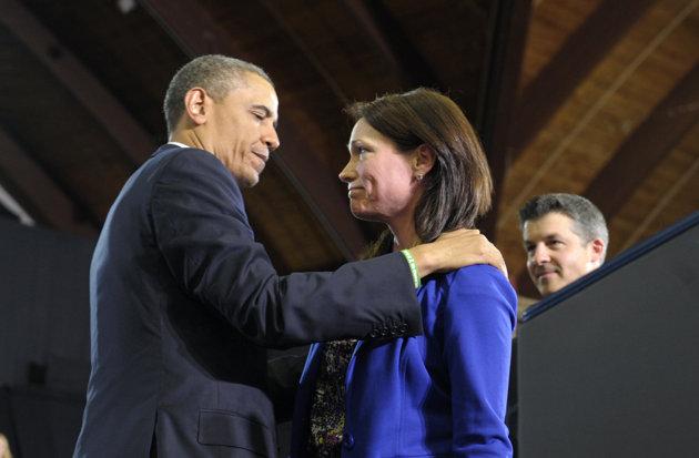 President Barack Obama looks at Nicole Hockley and her husband Ian, right, after she introduced him at the University of Hartford in Hartford, Conn., Monday, April 8, 2013. The Hockley's lost a child in the school shooting at Sandy Hook Elementary School in Newtoen, Conn. Obama said that lawmakers have an obligation to the children killed and other victims of gun violence to act on his proposals. (AP Photo/Susan Walsh)