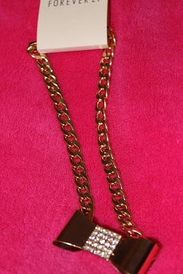 Gold bow with a diamonte centre on a thick gold chain- Forever 21- £4.90