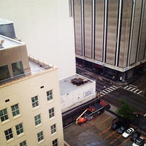 The last time I was in Dallas, I only saw it from the outskirts. I was driving through Texas from Marfa, and I stopped to get barbecue at a roadside joint. The downtown loomed in the distance like it had gotten lost on the horizon. 
Now I’m back, and it’s unseasonably cold here. The downtown still looms, but today, it’s obscured by a veil of rain. I’m staying in the midst of the concrete skyscrapers, on a street that looks, to an Easterner like me, like any post-Robert Moses city in Connecticut. Only the buildings in this town are far, far taller. They do things bigger, so I’ve heard, in Texas.
Despite the weather, I have a good feeling about this town. I like Texas. I like Texans. I like super-sized Truffle fries, and I like that there was only one salad on my room service menu. I like that there are no maps available for sightseeing, because no one walks here. I like that people hold doors. More to come, I’m sure, as I absorb it all.