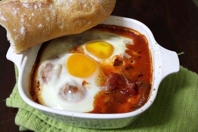 on baked egg in tomato chutney with raviolis...