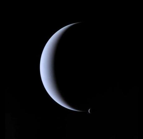 Neptune (crescent) and its satellite, Triton