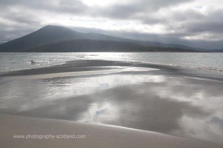 Photo - reflections at the tip of Corran Raa, the  sand spit on Taransay, Outer Hebrides, Scotland