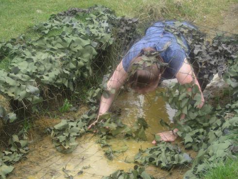 Trying to crawl through a swampy pit whilst getting tangled up in an army net! (Strangely liberating.)
