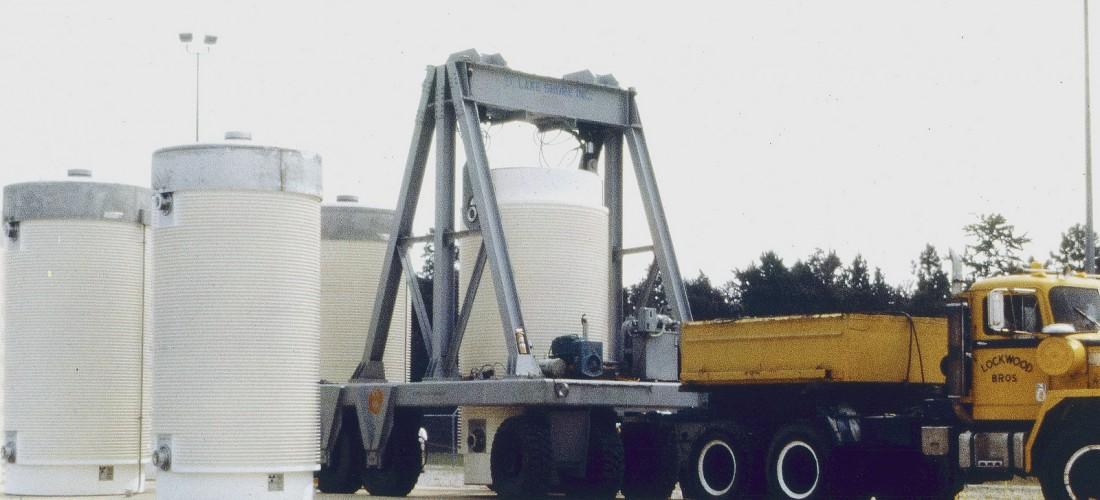 Image of dry cask transported and placed on concrete pad at nuclear plant site. (Credit: U.S. Nuclear Regulatory Commission)