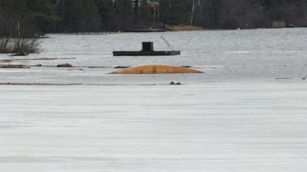 Oxtongue Lake flooding - sunken canoe and firewood adrift on lake  - April 20 2013