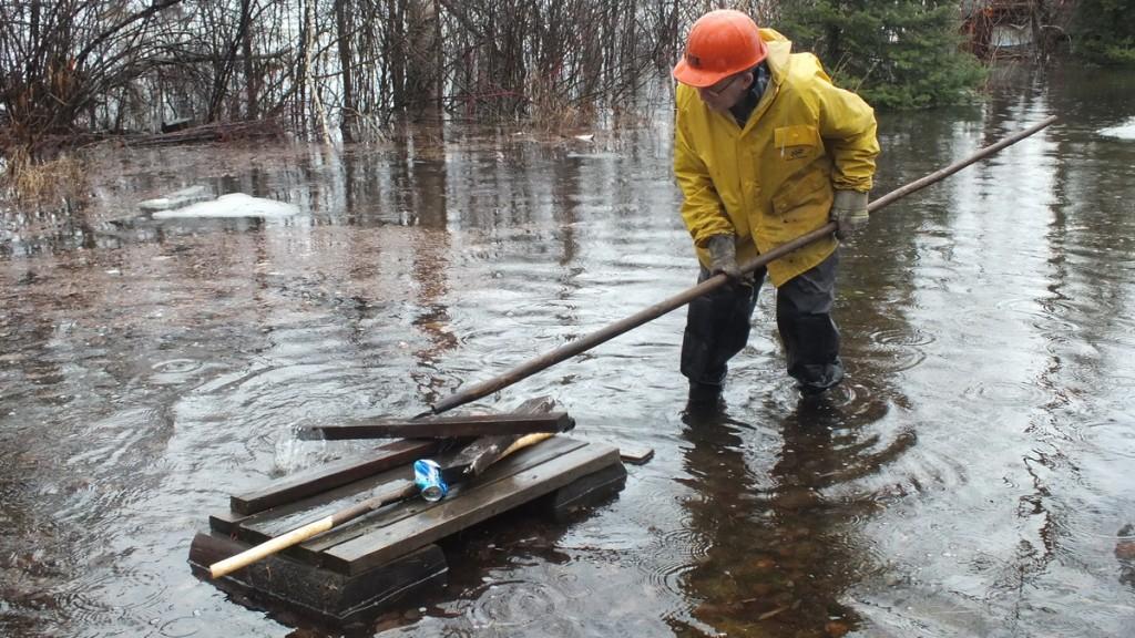 Oxtongue Lake flooding - marvin puts new hip waders to good use - April 20 2013