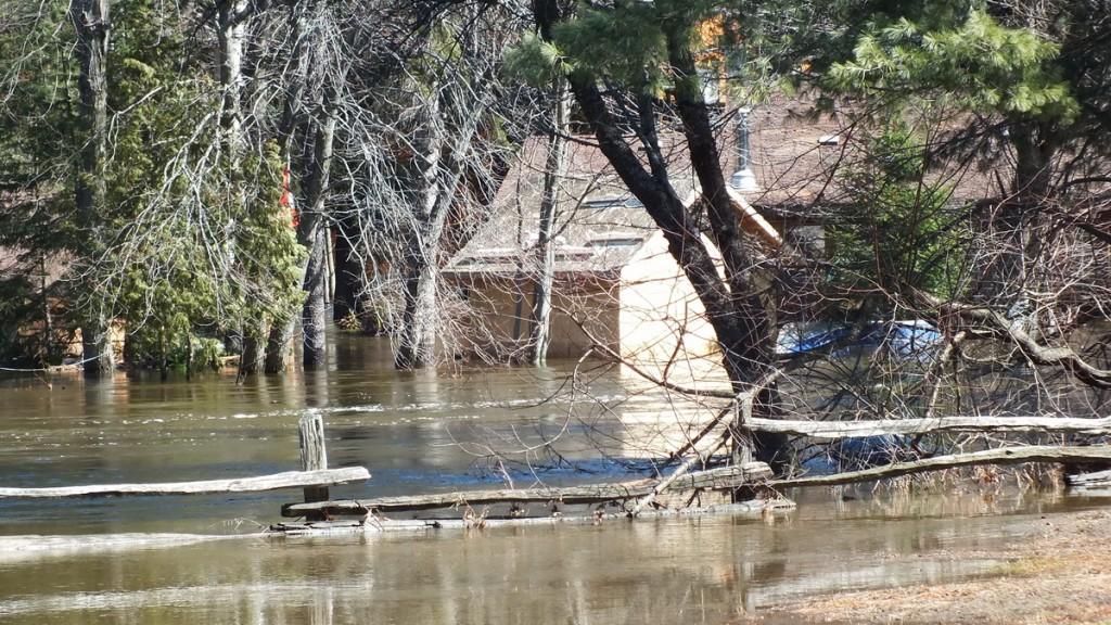 Big East River flood zone - flooded forest and homes - Huntsville, Ontario - April 21 2013