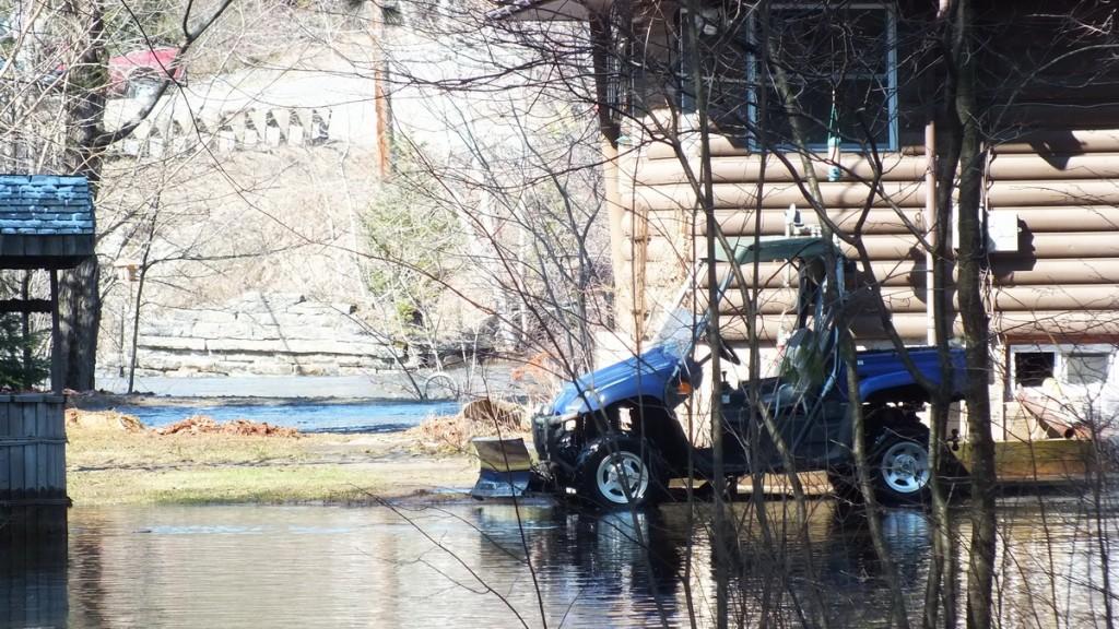 Big East River flood zone - plowing water - Huntsville, Ontario - April 21 2013