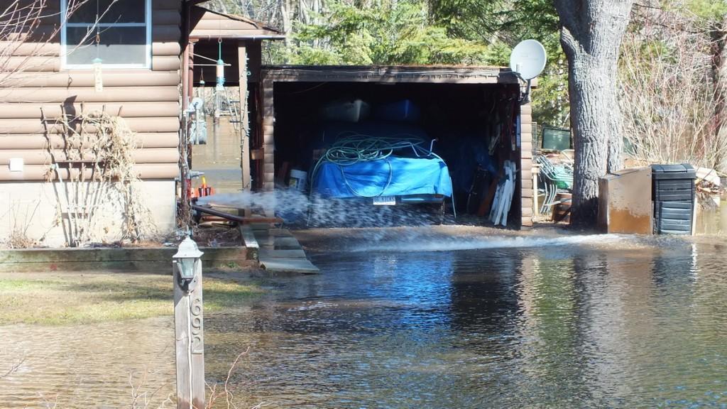 Big East River flood zone - sump pump hard at work - Huntsville, Ontario - April 21 2013