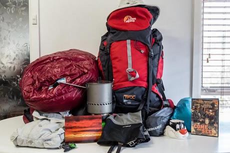 mixture of hiking equipment on table