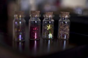 Here are the 4 handmade bottles I made today... from left to right... multi coloured glitter, red glitter, starts found in my confetti box that I've collected all my life, so they will be from different occasions, and last but definitely not least, dried flowers from when I was Christened 11 years ago. 