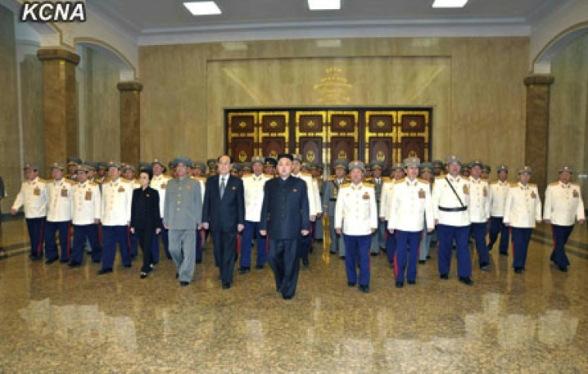 Kim Jong Un (8th L) and senior members of the DPRK's national security community pay their respects to statues of Kim Il Sung and Kim Jong Il at the Ku'msusan Memorial Palace in Pyongyang on 25 April 2013, the official 81st anniversary of the foundation of the Korean People's Army.(Photo: KCNA)