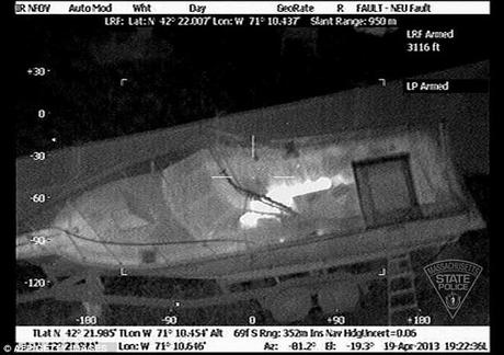 Hidden: Authorities located bombing suspect Dzhokhar Tsarnaev using infrared light, which lit up his body hiding under a tarp