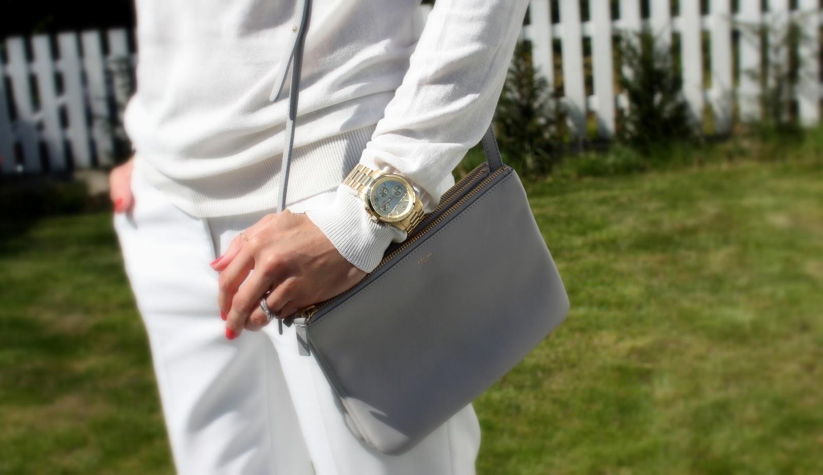 All white, snake-effect shoes and a mini bag