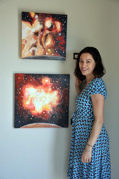 Cedar Lee Artist with her paintings Top: Fiery Stardust. © Cedar Lee 2013 Bottom: The Source. © Cedar Lee 2013