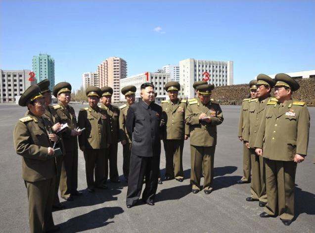 Kim Jong Un (1) on the plaza in front of the Ministry of People's Security headquarters in Pyongyang, prior to commemorative photo-ops on May Day (1 May) in Pyongyang.  Also in attendance are Minister of People's Security, Col. Gen. Choe Pu Il (3) and Director of the KPSIF Political Bureau, Col. Gen. Ri Pyong Sam (2) (Photo: Rodong Sinmun)