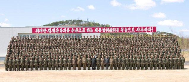 Kim Jong Un poses for a commemorative photograph with officers and service members of Korean People's Internal Security Forces Unit #2219 on 1 May 2013 (Photo: Rodong Sinmun)