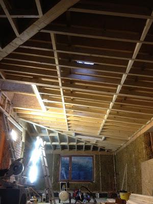 Electric mitre-saw and view of the roof, with two layers of rafters to allow insulation.