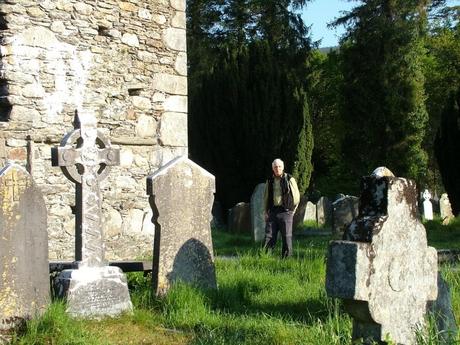 Bob stands beside Glendalough Cathedral - Ireland
