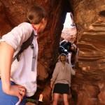 Climbing up into a slot canyon.