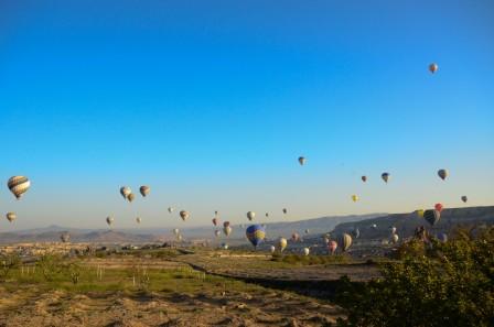 many hot air balloons over goreme