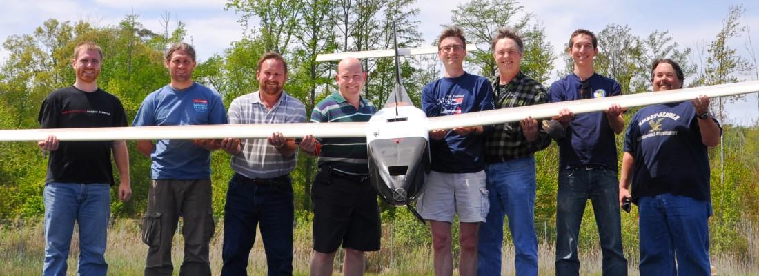 The NRL flight crew holds the Ion Tiger unmanned aerial vehicle (UAV). From left to right: Dan Edwards, Mike Baur, Steve Carruthers, Joe MacKrell, Rick Stroman, Mike Schuette (Sotera Defence), Drew Rodgers and Chris Bovais. (Photo: U.S. Naval Research Laboratory)