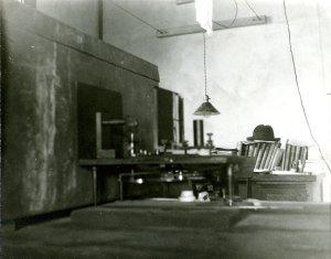 X-ray apparatus assembled on Linus Pauling's desk in the basement of the Gates Laboratory, 1925. Pauling's hat is seen in the rear of the photo.