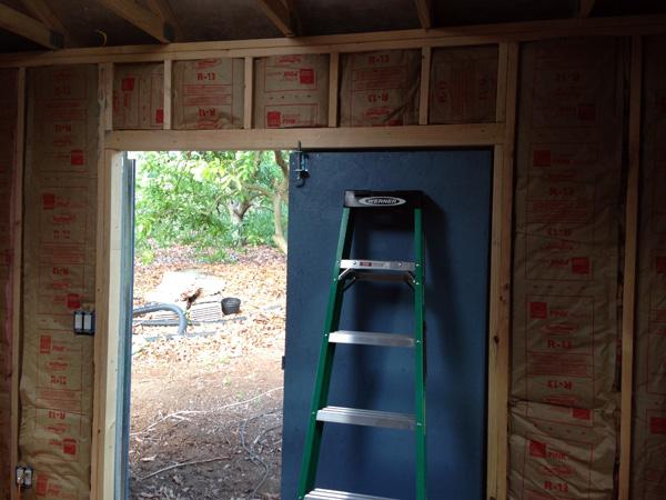 Construction underway on artist Cedar Lee's painting studio. Insulation installed.