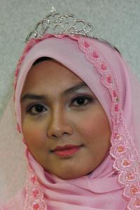 A classic Malay type, a very beautiful woman. Note the Muslim headscarf. 