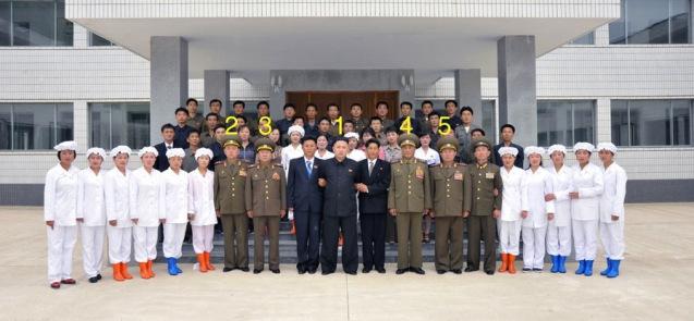 Kim Jong Un (1) poses for a commemorative photograph with managers and employees of the Ryongmun Liquor Factory.  Also in attendance are Lt. Gen. Pak Jong Chon (2), VMar Choe Ryong Hae (3), Col. Gen. Jon Chang Bok (4) and Col. Gen. So Hong Chang (5).  (Photo: Rodong Sinmun)