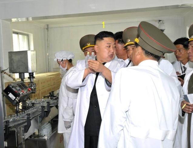Kim Jong Un (1) tours the production line at Ryongmun Liquor Factory. (Photo: Rodong Sinmun)