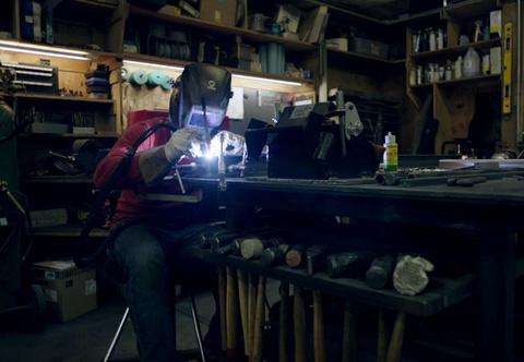 Ironworker working with metal at 12th Avenue Iron in Seattle.