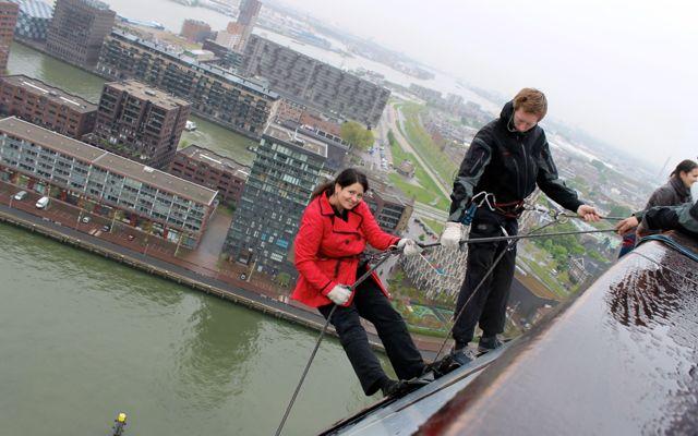 Getting ready to step off the ledge while abseiling from the Euromast.